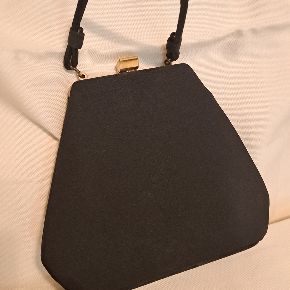 Elegant Black Wristlet with Gold Hardware